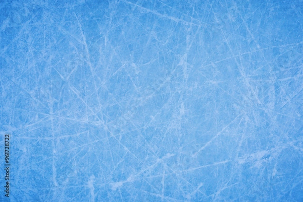 Fototapeta Ice background with marks from skating and hockey, blue texture of rink surface with many scratches