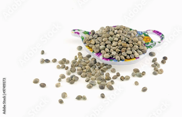 Fototapeta Hemp seeds on a small colorful plate