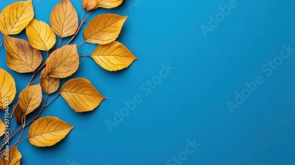 Fototapeta A close up of a branch with yellow leaves on it, AI