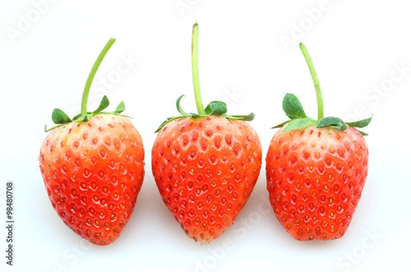 Fototapeta Three fresh strawberries isolated on white background.