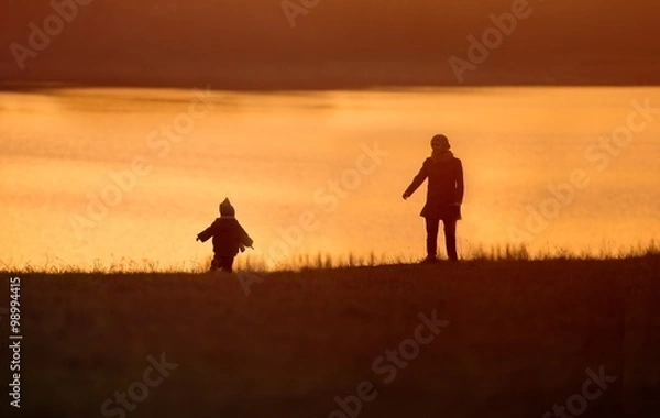 Obraz Little boy playing outdoor on lake shore.