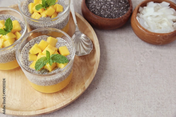 Fototapeta Homemade Chia seed pudding with mango, selective focus, toning